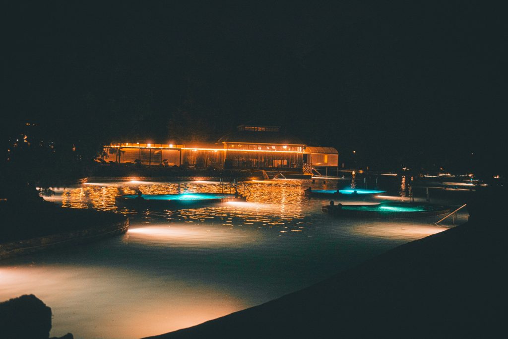 A night view of a lake with lights on it